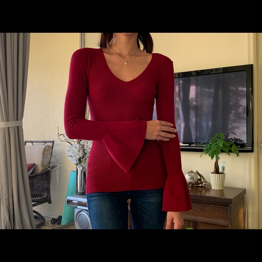 Women’s long flared sleeve shirt.